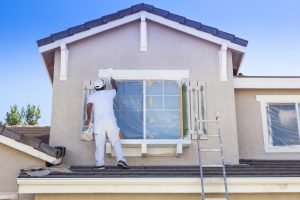 Main painting a house